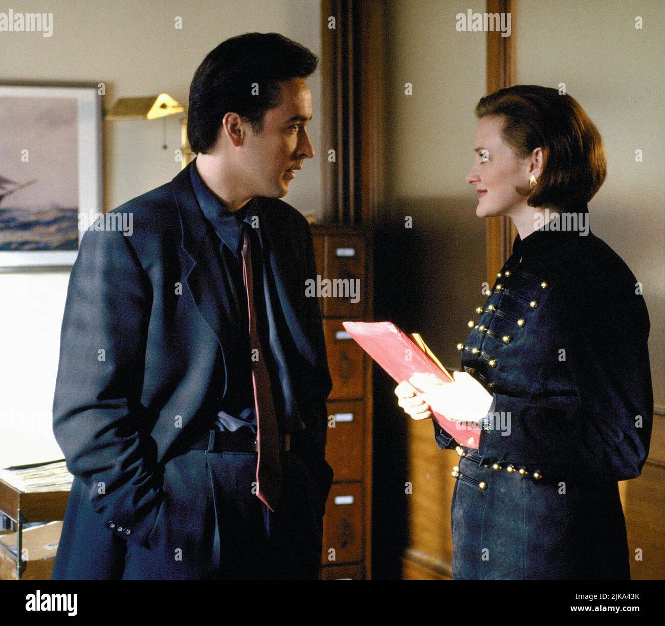 John Cusack & Joan Cusack Film: Grosse Pointe Blank (1997) Characters: Martin Q. Blank & Marcella  Director: George Armitage 11 April 1997   **WARNING** This Photograph is for editorial use only and is the copyright of BUENA VISTA and/or the Photographer assigned by the Film or Production Company and can only be reproduced by publications in conjunction with the promotion of the above Film. A Mandatory Credit To BUENA VISTA is required. The Photographer should also be credited when known. No commercial use can be granted without written authority from the Film Company. Stock Photo