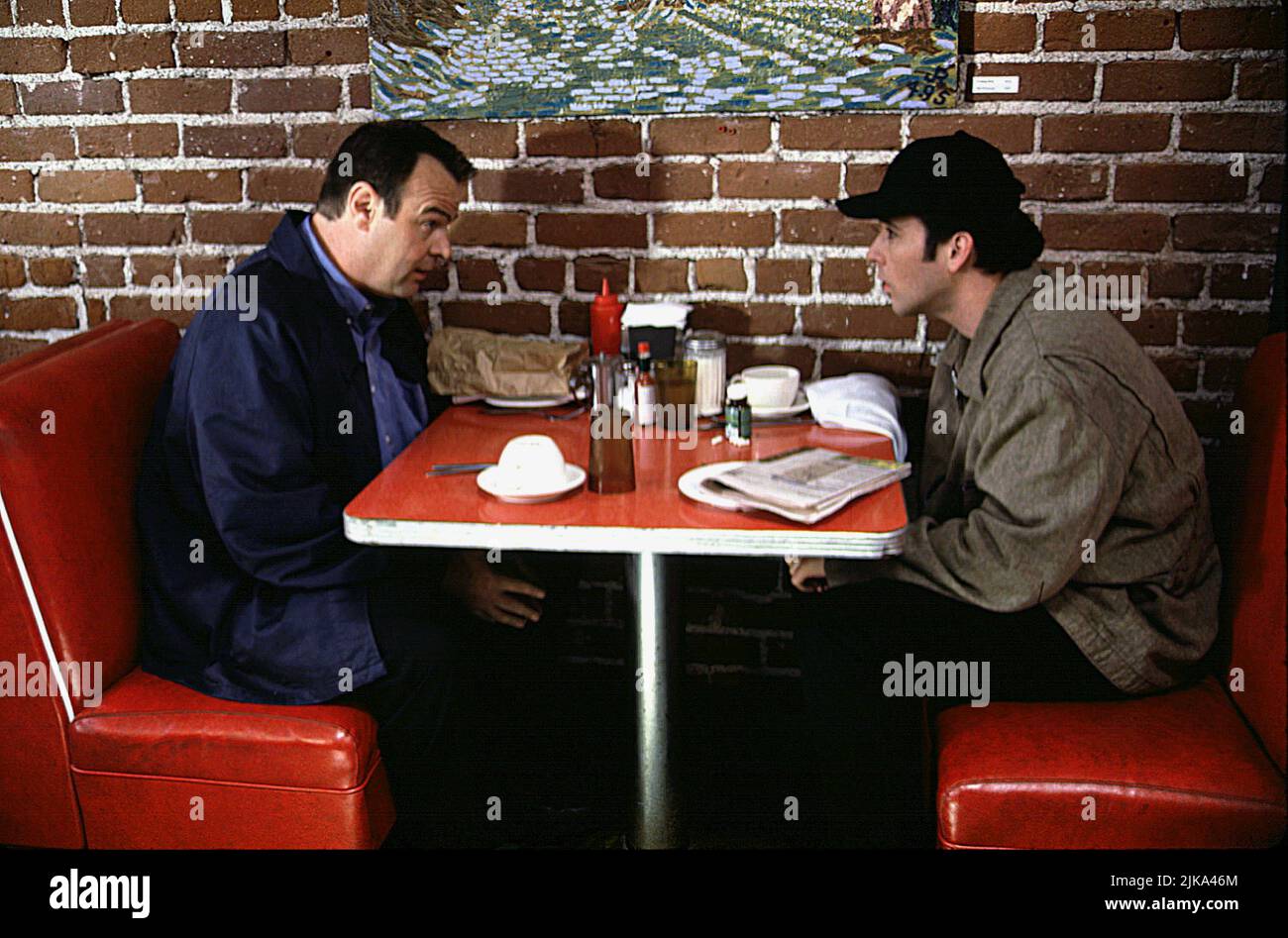 Dan Aykroyd & John Cusack Film: Grosse Pointe Blank (1997) Characters: Grocer & Martin Q. Blank  Director: George Armitage 11 April 1997   **WARNING** This Photograph is for editorial use only and is the copyright of BUENA VISTA and/or the Photographer assigned by the Film or Production Company and can only be reproduced by publications in conjunction with the promotion of the above Film. A Mandatory Credit To BUENA VISTA is required. The Photographer should also be credited when known. No commercial use can be granted without written authority from the Film Company. Stock Photo