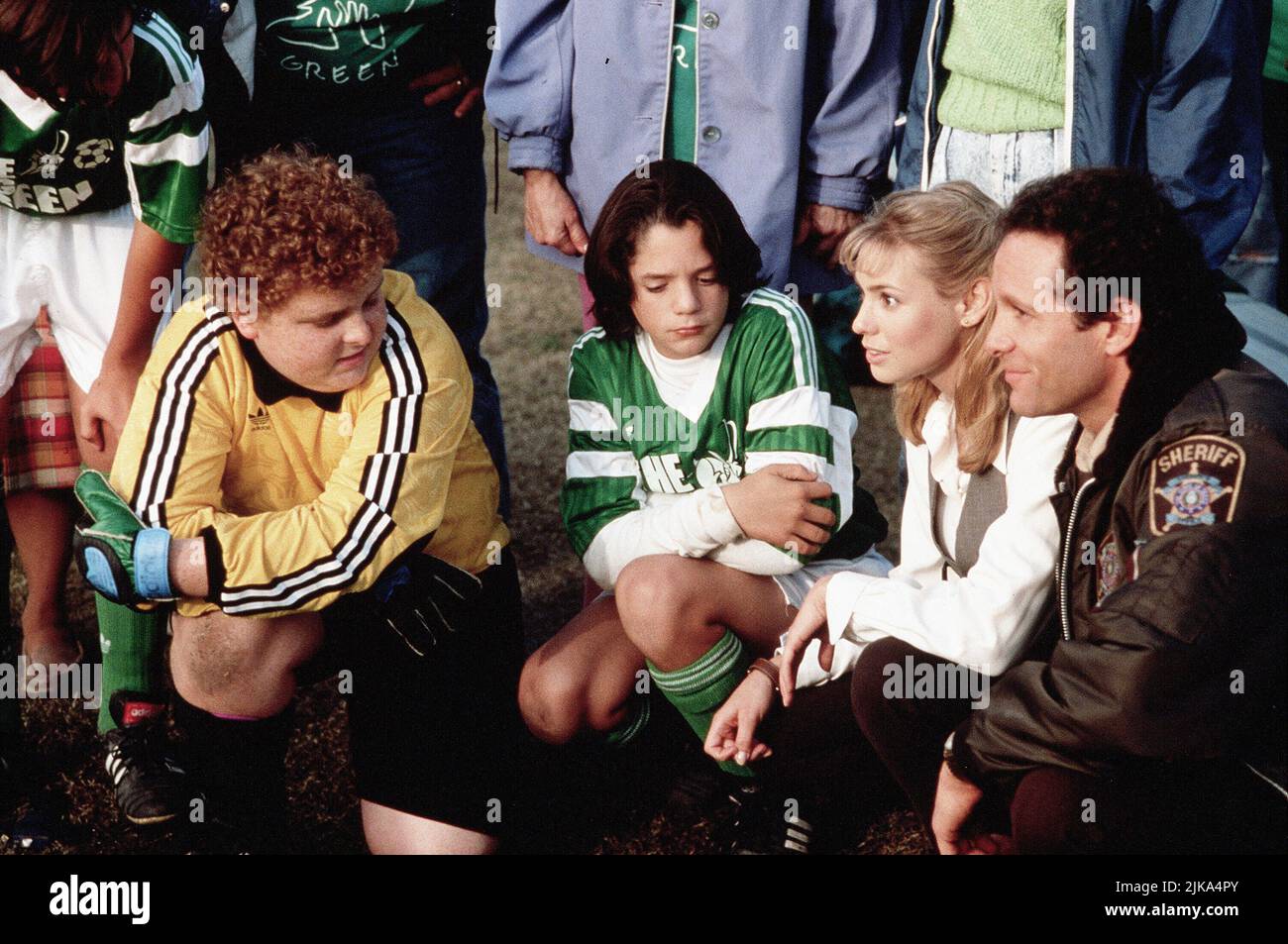 Patrick Renna, Billy L. Sullivan, Olivia D'Abo & Steve Guttenberg Film: The Big Green (1995) Characters: Larry Musgrove,Jeffrey Luttrell,Miss Anna Mongomery & Sheriff Tom Palmer  Director: Holly Goldberg Sloan 29 September 1995   **WARNING** This Photograph is for editorial use only and is the copyright of DISNEY and/or the Photographer assigned by the Film or Production Company and can only be reproduced by publications in conjunction with the promotion of the above Film. A Mandatory Credit To DISNEY is required. The Photographer should also be credited when known. No commercial use can be gr Stock Photo