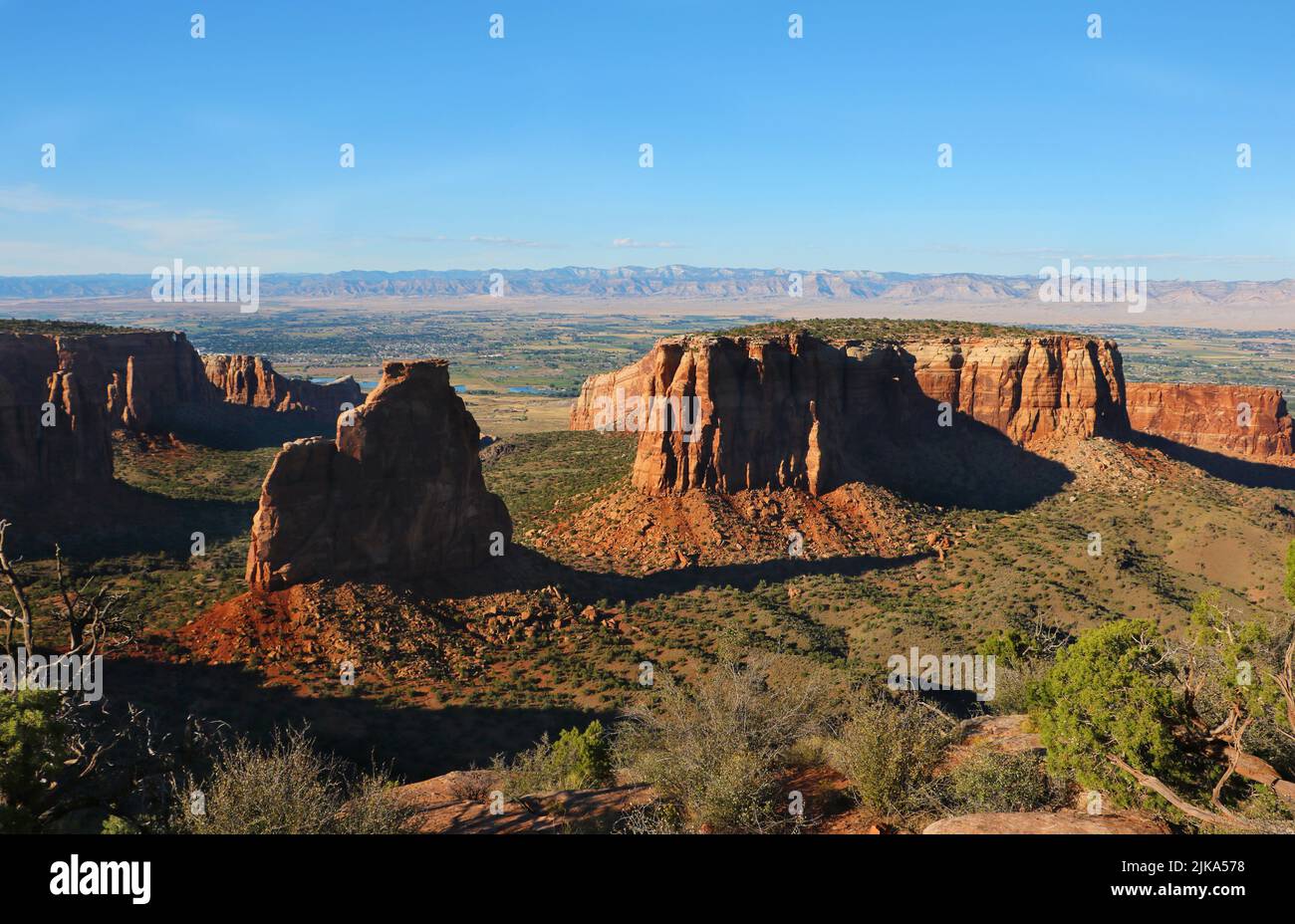 Late afternoon sunlight with long shadows overlooking sandstone