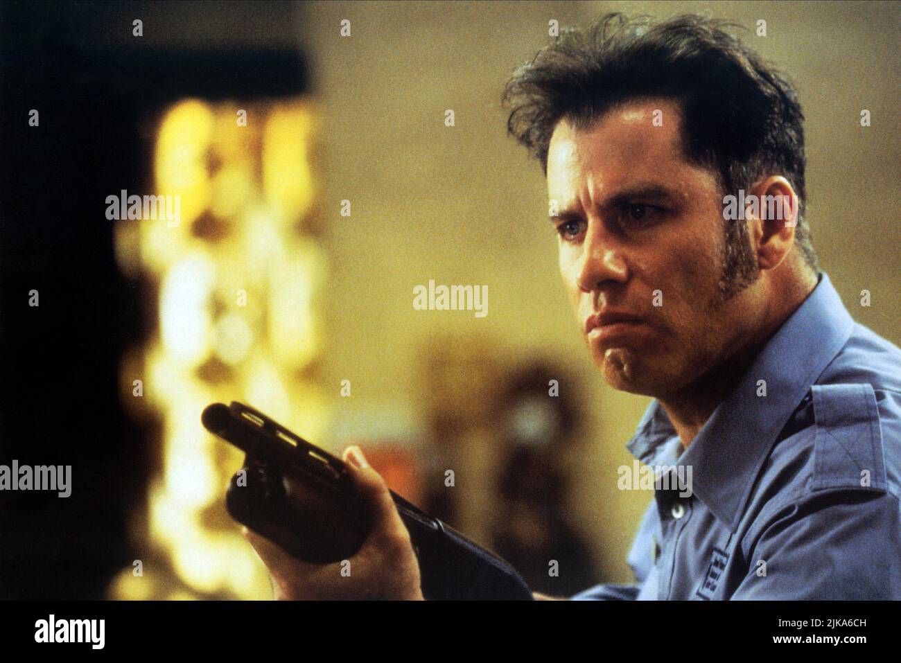 John Travolta Film: Mad City (1997) Characters: Sam Baily  Director: Costa-Gavras 10 October 1997   **WARNING** This Photograph is for editorial use only and is the copyright of WARNER BROS and/or the Photographer assigned by the Film or Production Company and can only be reproduced by publications in conjunction with the promotion of the above Film. A Mandatory Credit To WARNER BROS is required. The Photographer should also be credited when known. No commercial use can be granted without written authority from the Film Company. Stock Photo