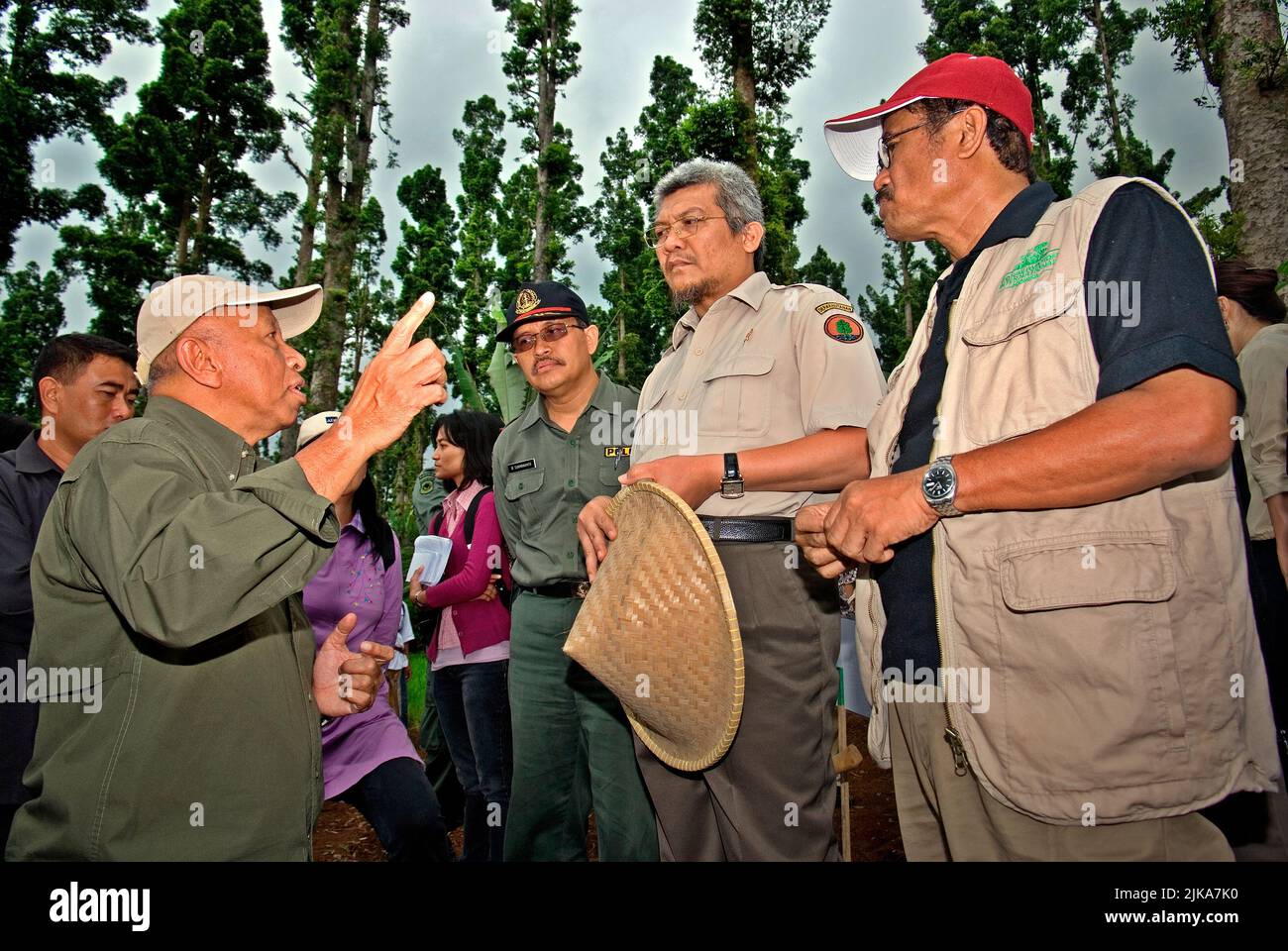 Conservation International-Indonesia director Jatna Supriatna, founder of Medco Energi International Arifin Panigoro and Indonesian Minister of Forestry MS Kaban (left to right) are having a conversation during an event organized by Conservation International (CI)-Indonesia and Gede Pangrango National Park in Nagrak, a village that lies on the border of the national park in Sukabumi, West Java, Indonesia. Stock Photo