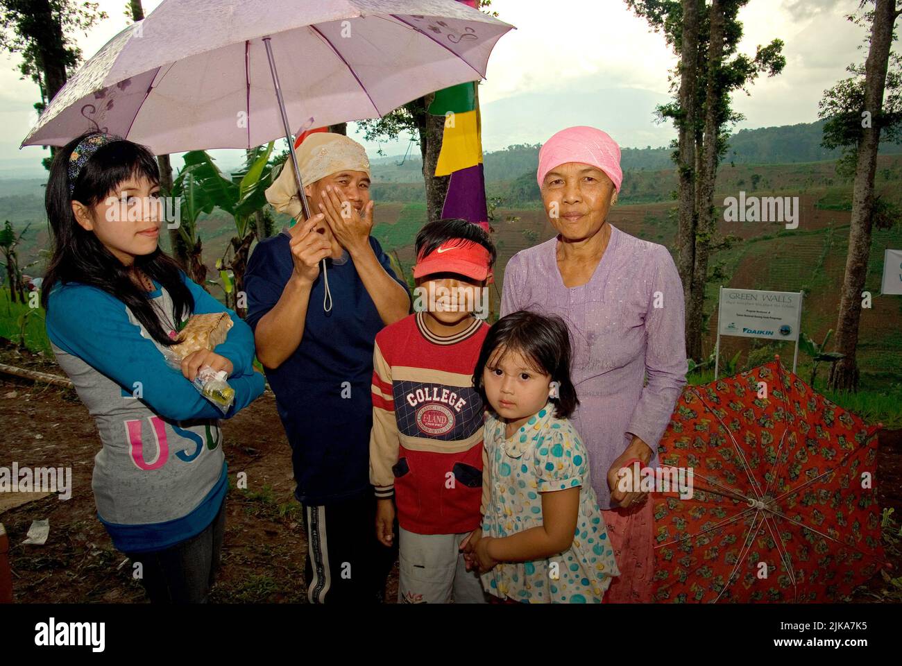 Group portrait of women farmers and children in Nagrak, a farming village located on the border of Gede Pangrango National Park in Cibadak, Sukabumi, West Java, Indonesia. Stock Photo