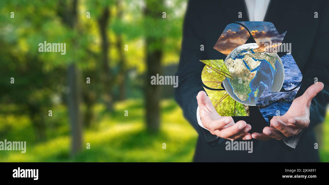 Environment concept Business man hold and show global with eco icon ...
