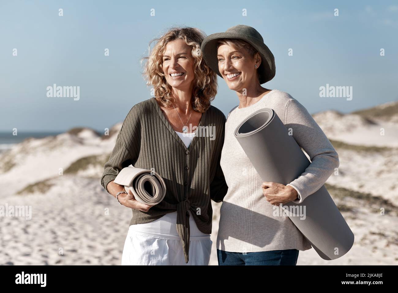 Where should we set up. two attractive mature woman standing with their