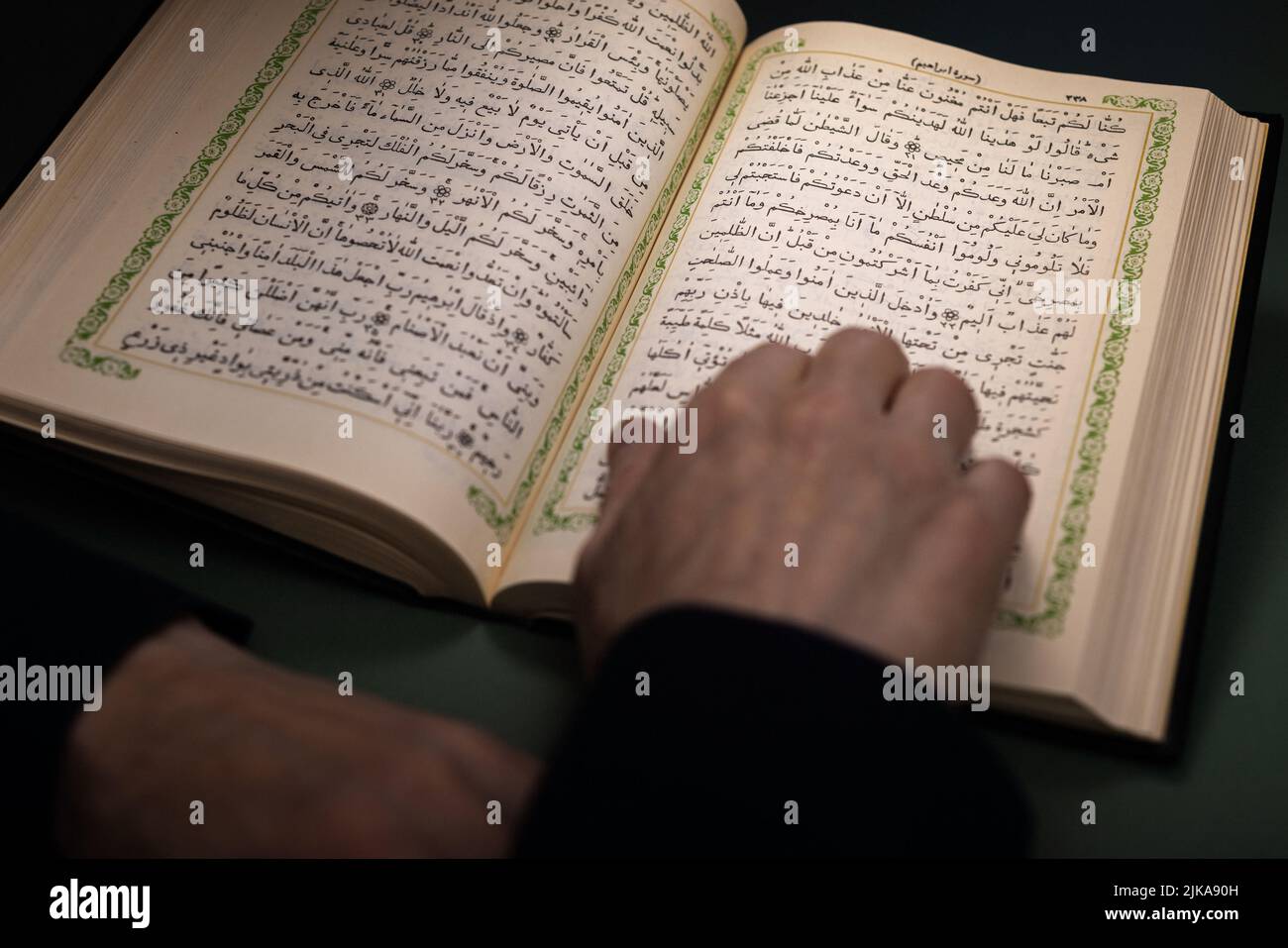 Backview of a muslim man reading holy al Quran in mosque-Russia, Ulyanovsk: June 30, 2022 Stock Photo