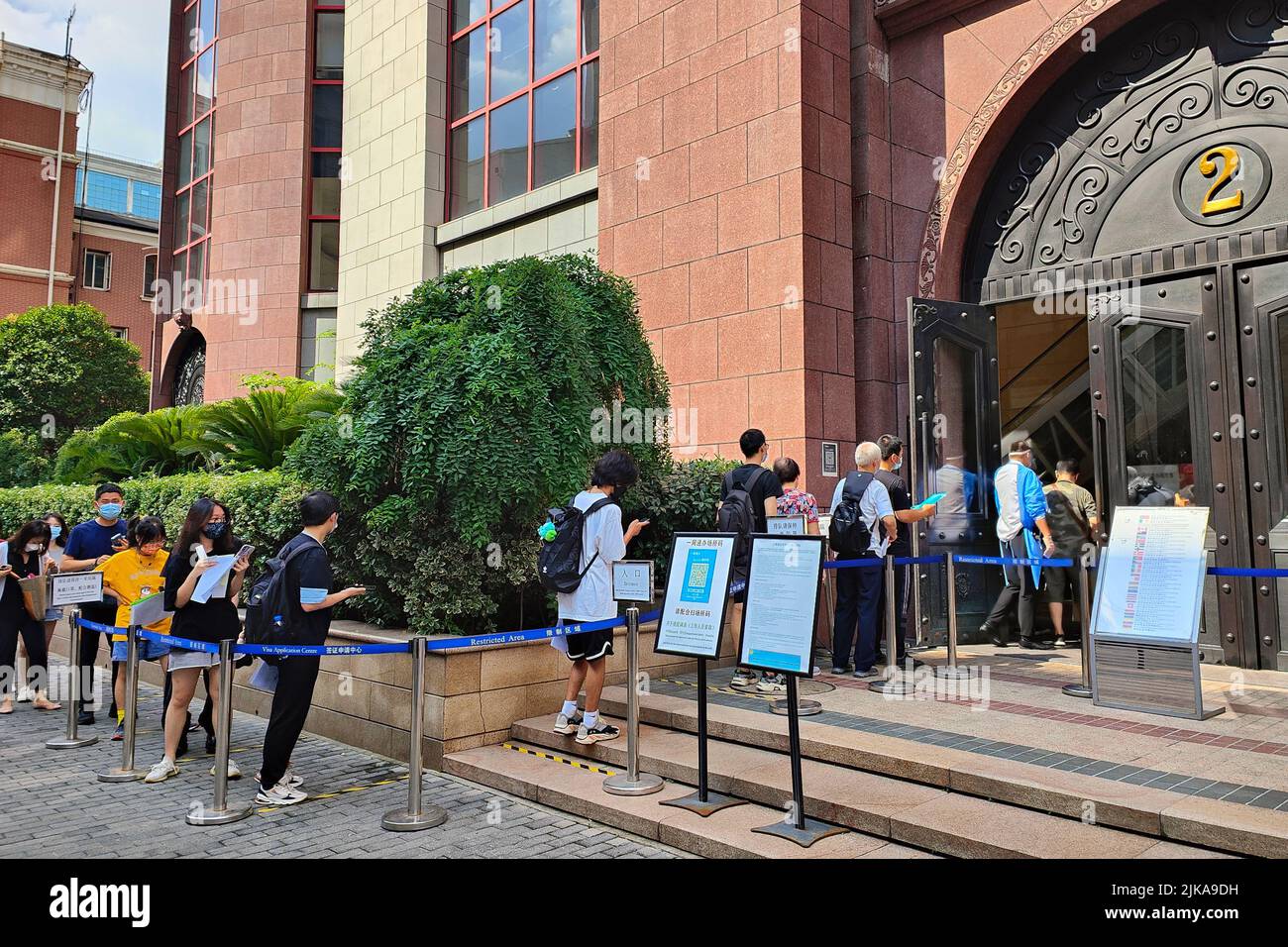 SHANGHAI, CHINA - AUGUST 1, 2022 - A long queue forms in front of a ...