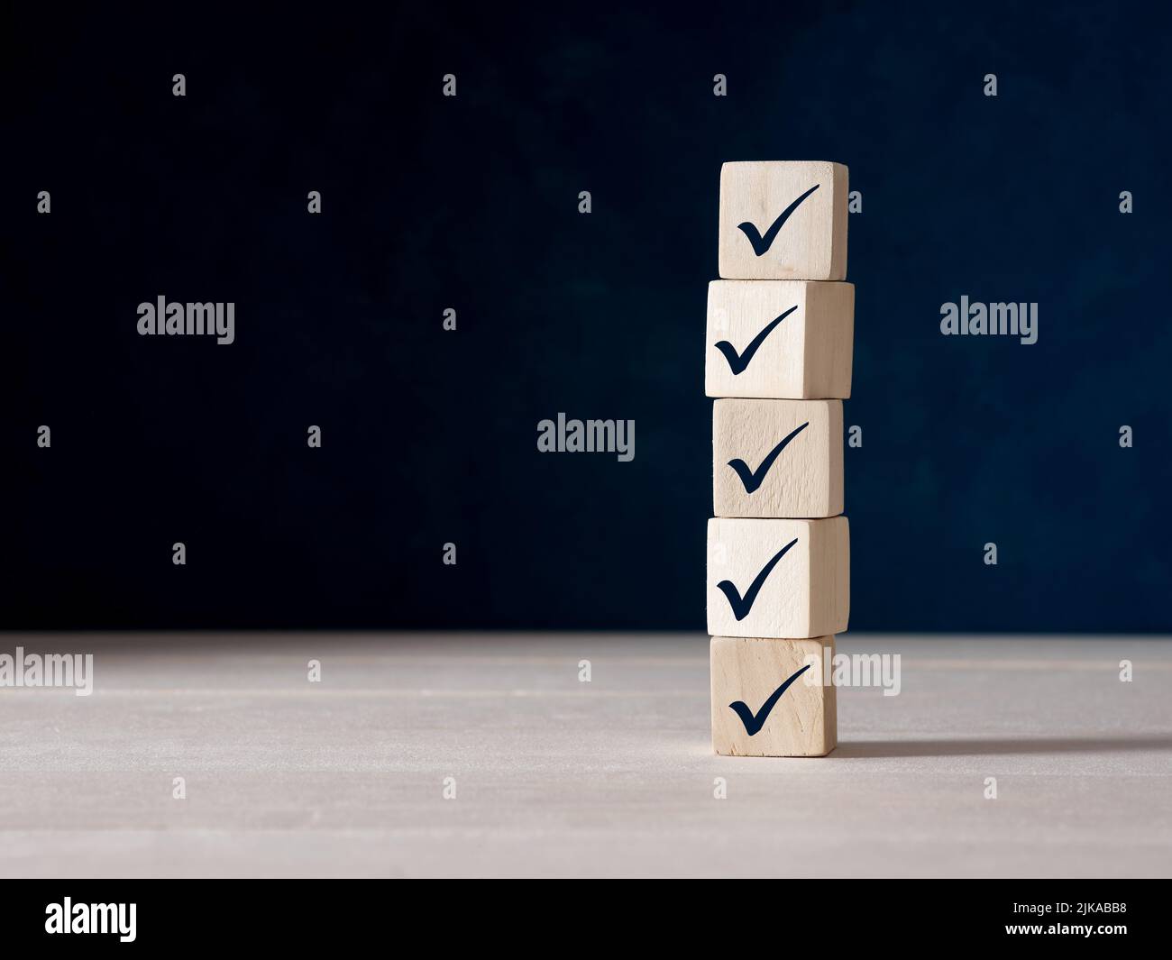 Checklist concept. Checkmark on ascending wooden blocks. Stock Photo