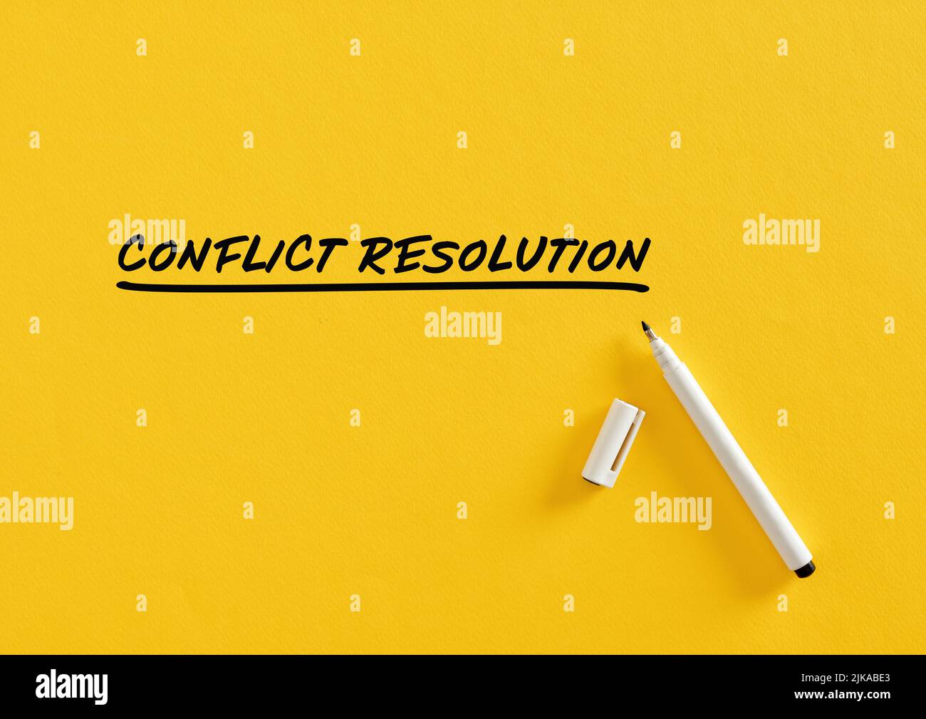 Conflict resolution message written on yellow background with felt tip pen. Business concept. Stock Photo