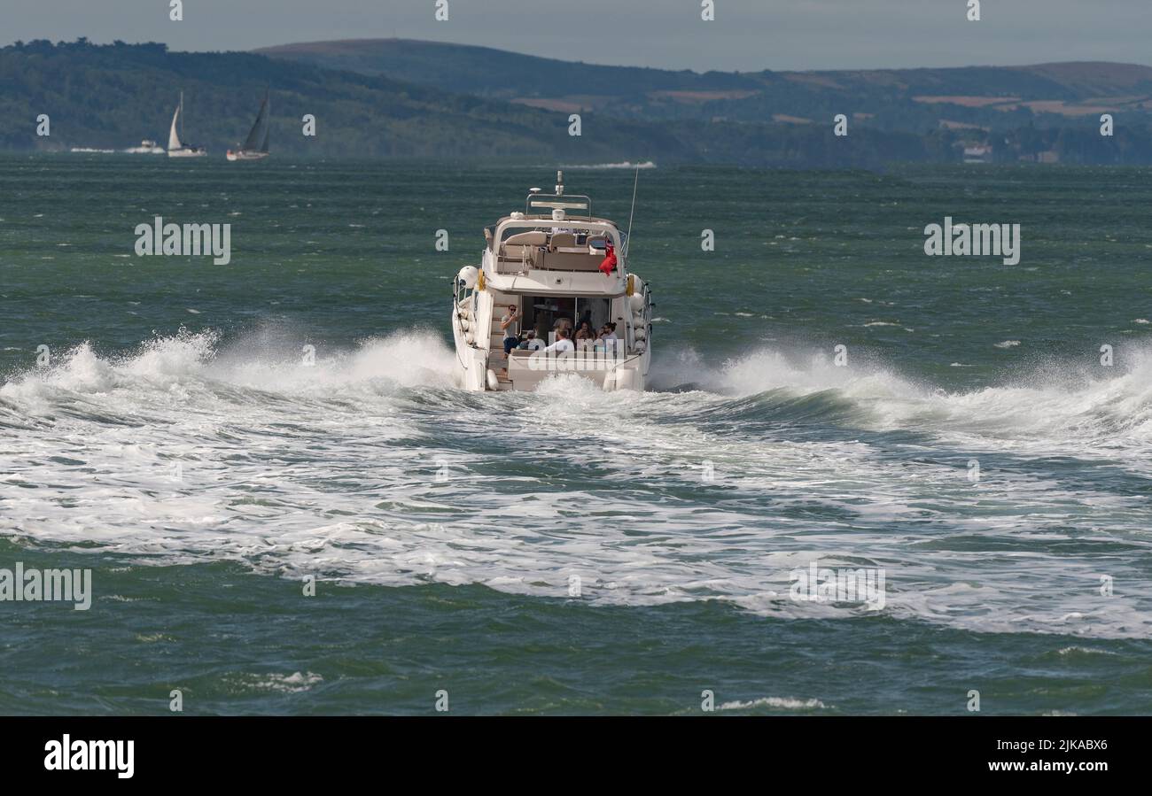 The Solent, southern England, UK. 2022. Luxury powerboat underway crossing the Sollent towards the Isle of Wight, UK Stock Photo