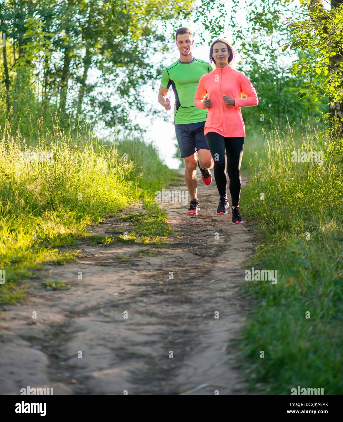 couple jogging in the park wellness running Stock Photo