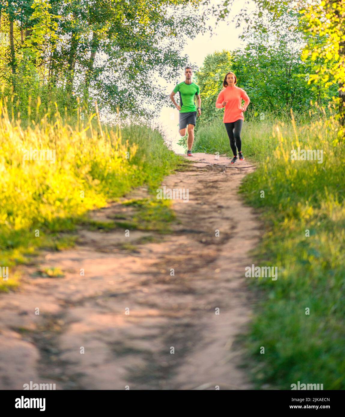 couple jogging in the park wellness running Stock Photo