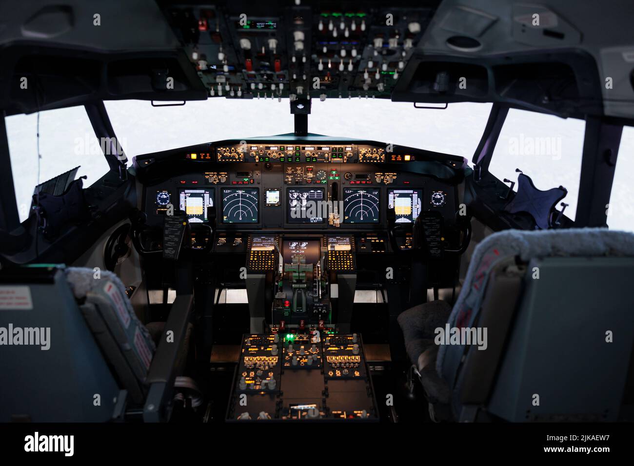 Nobody in airplane cockpit with electronic flying navigation panel, control  command with buttons and lever on dashboard. No people in aircraft cabin to  throttle engine and takeoff Stock Photo - Alamy