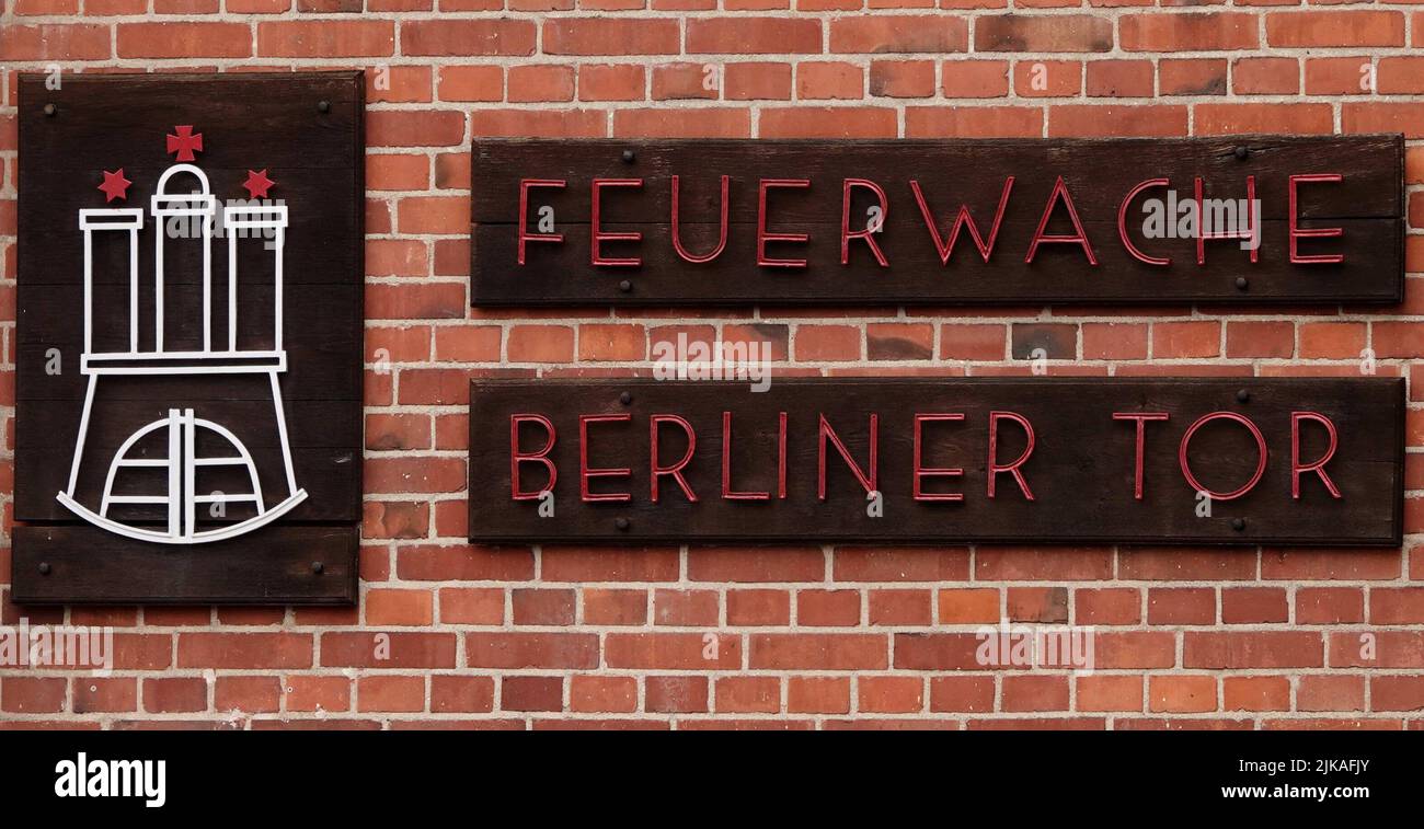 Hamburg, Germany. 22nd July, 2022. A sign reading 'Feuerwache Berliner Tor' hangs on the building of the Berliner Tor fire and rescue station. Unlike many other training companies, the Hanseatic city's professional fire department has had no difficulty recruiting new recruits so far. Around 1,200 people apply for up to 220 open training or course positions. Credit: Julian Weber/dpa/Alamy Live News Stock Photo