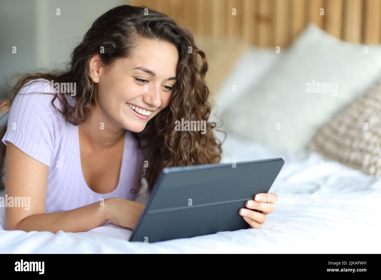 Girl watching tv in bedroom hires stock photography and images Alamy