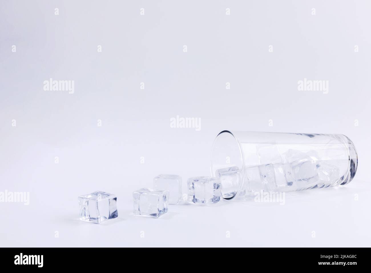 creative summer photo of ice and water cup, white background Stock ...