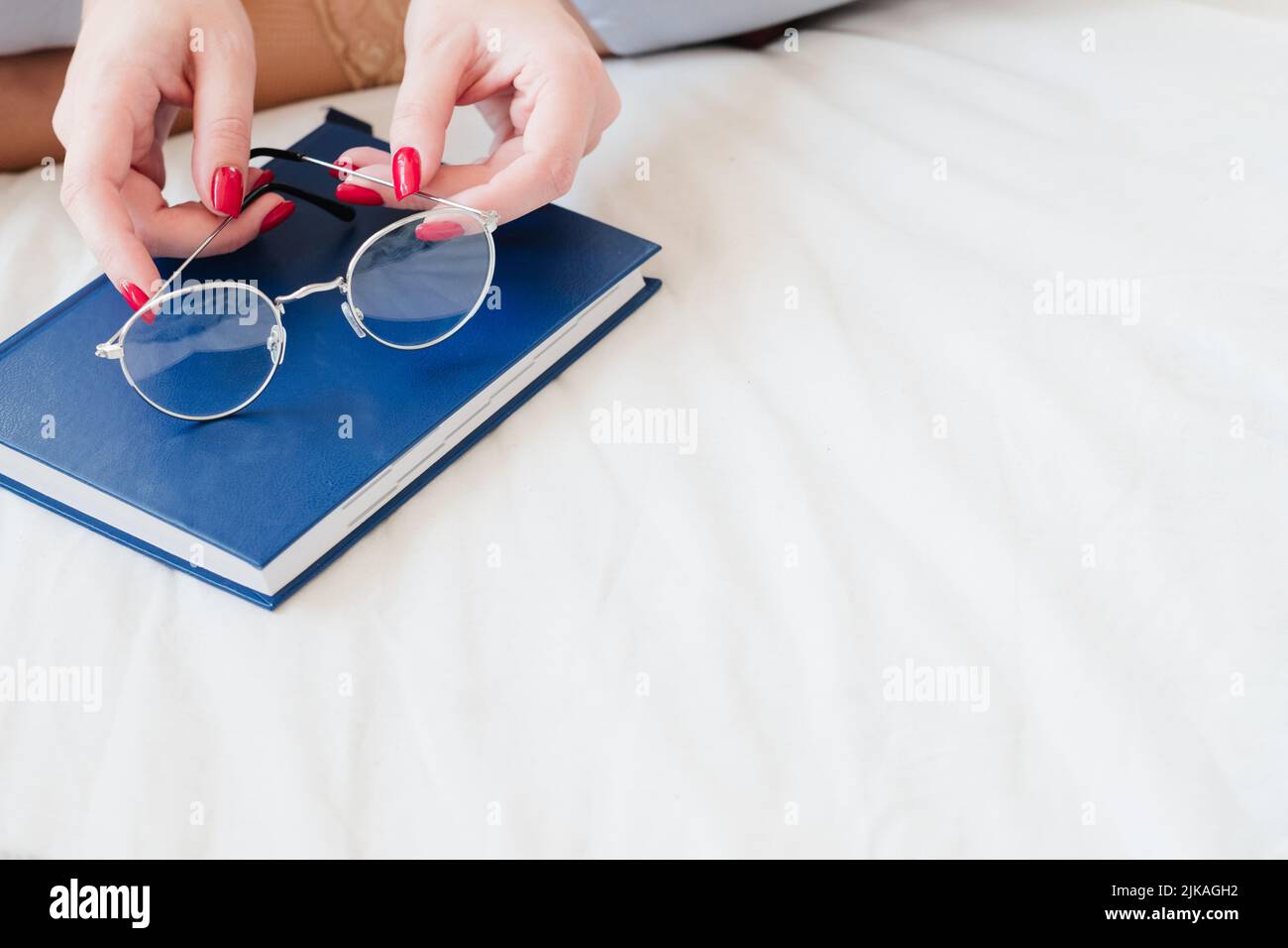 event planning woman hand glasses closed diary Stock Photo
