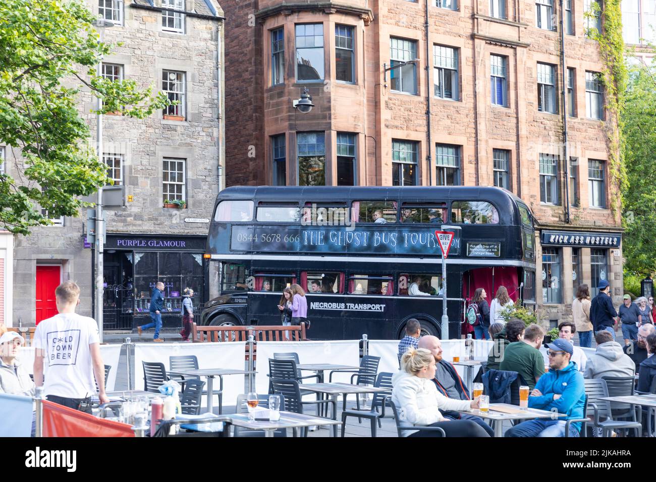 Ghost tours black double decker bus in Grassmarket, Edinburgh old town, Scotland,UK, summers day 2022 Stock Photo