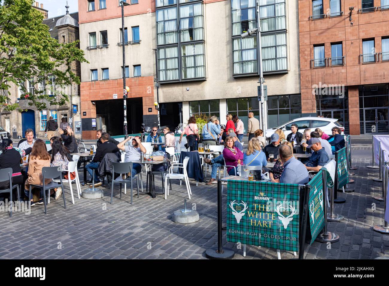 Edinburgh old town, people enjoying drinks and a beer in the Grassmarket area at the White Hart Inn pub,Edinburgh old town,Scotland,summer 2022 Stock Photo