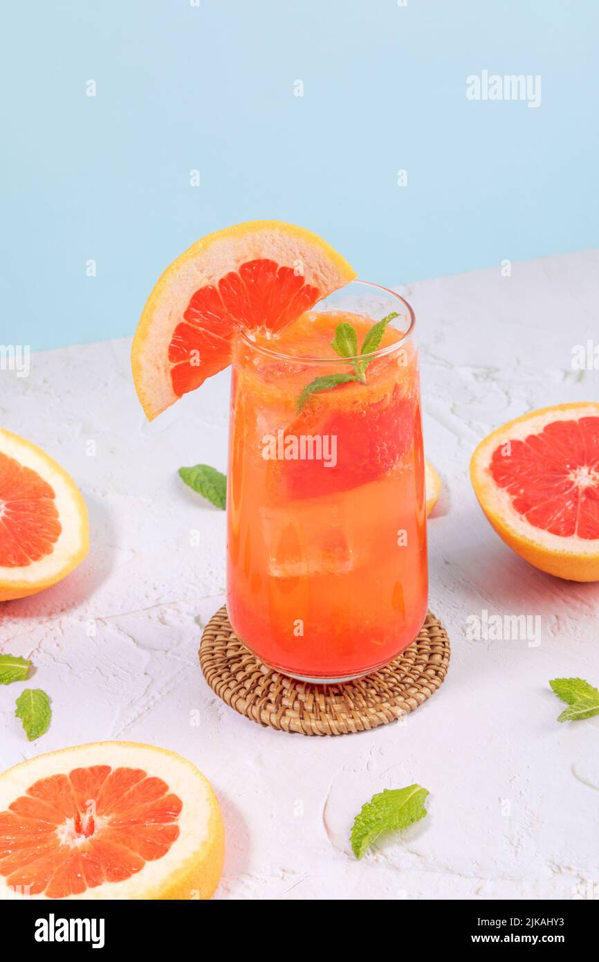 summer background with grapefruit ade, juice drink with grapefruits