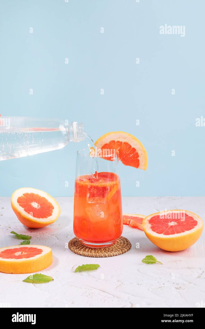summer background with grapefruit ade, juice drink with grapefruits
