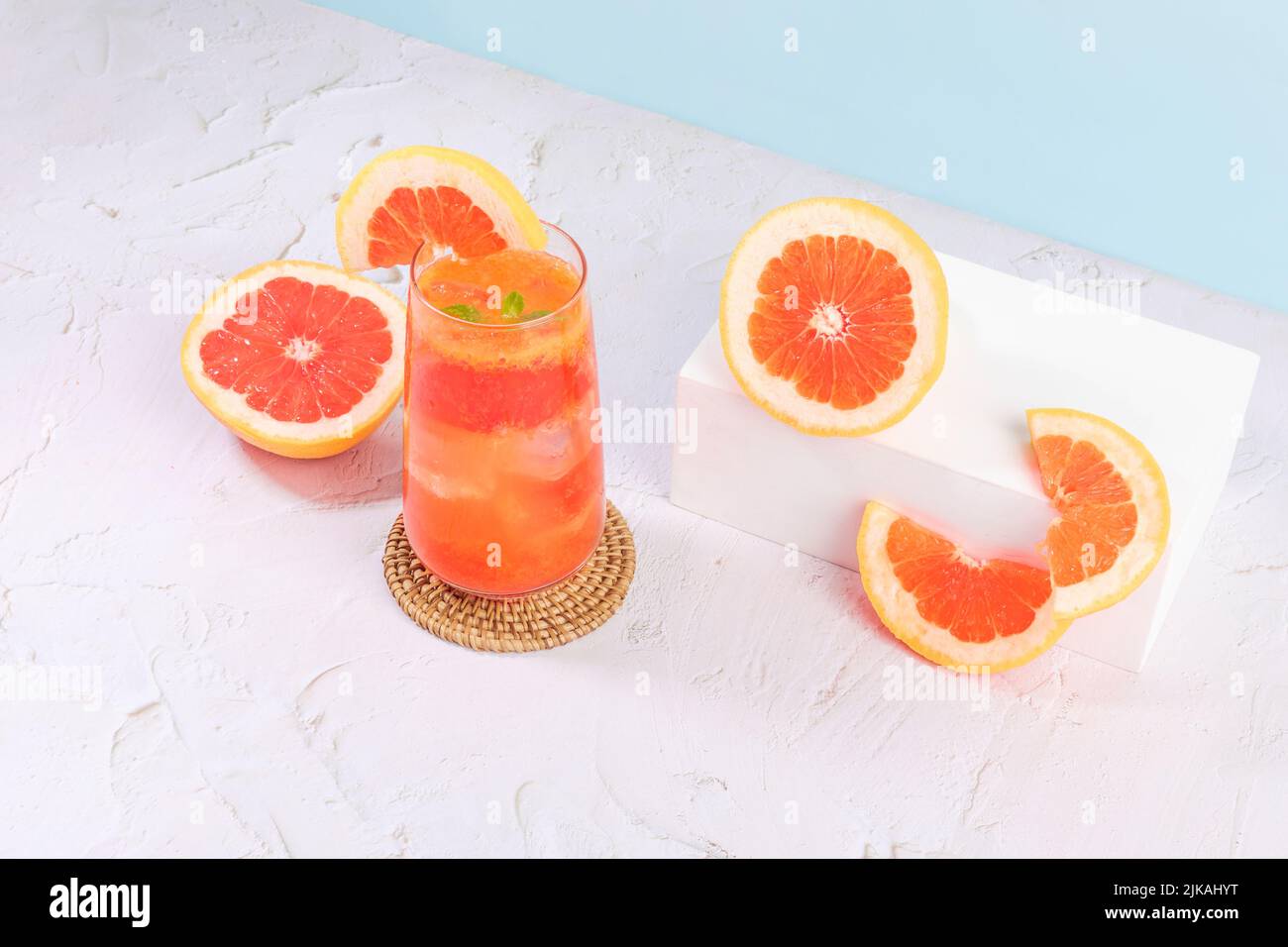 summer background with grapefruit ade, juice drink with grapefruits