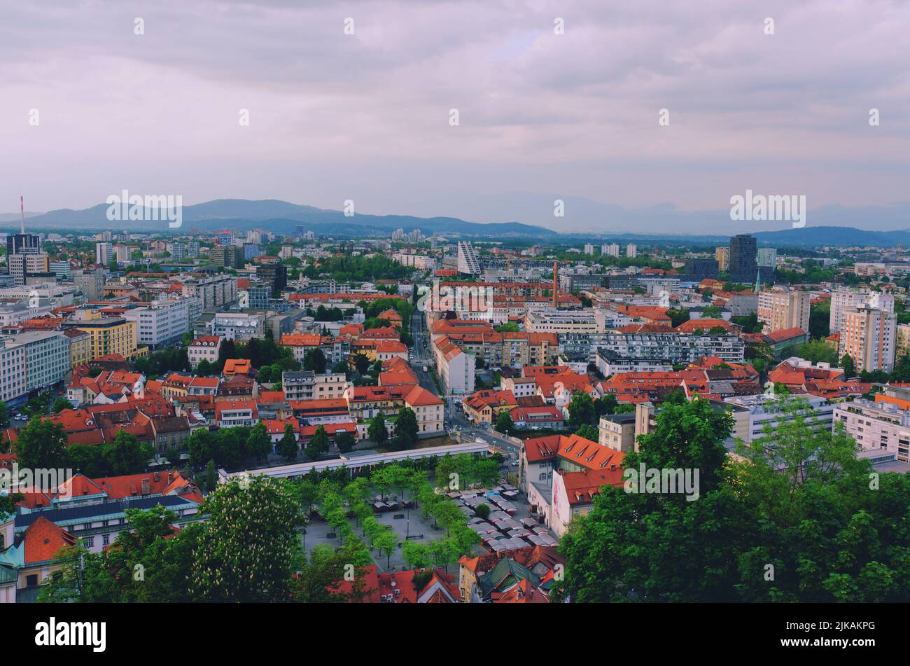 Aerial panoramic view of Ljubljana, capital of Slovenia in warm sunset light. Travel destination. Red roofs. Stock Photo