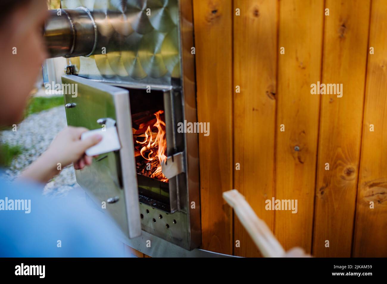 A closeup shot of pieces of wood burning inside old metal oven Stock Photo  - Alamy