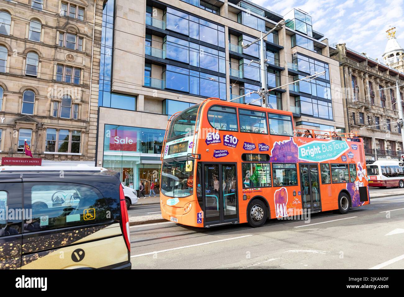 Princes street Edinburgh, sightseeing tour bus on princes street in the city centre,Scotland,Summer 2022 Stock Photo