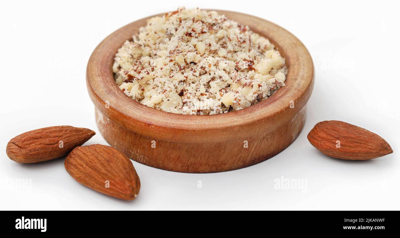 Crushed with peeled almond over white background Stock Photo