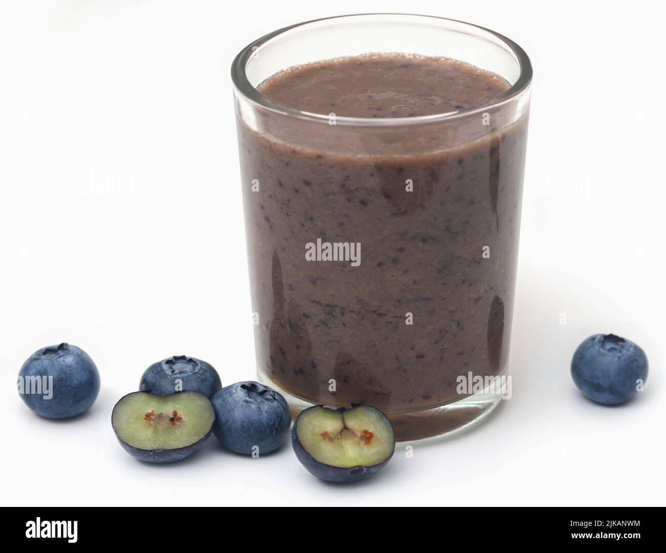 Fresh blueberries and juice in a glass over white background Stock Photo