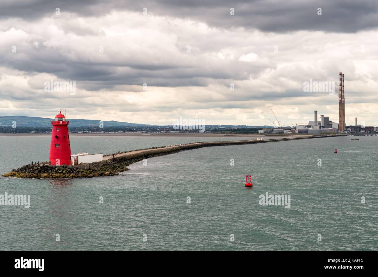 The red Poolbeg Lighthouse at the entrance to Dublin Port in Ireland Stock Photo