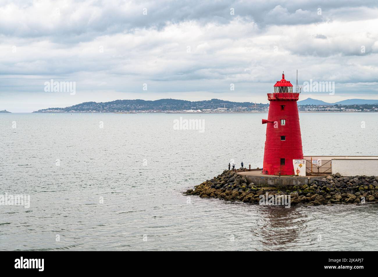 The red Poolbeg Lighthouse at the entrance to Dublin Port in Ireland Stock Photo
