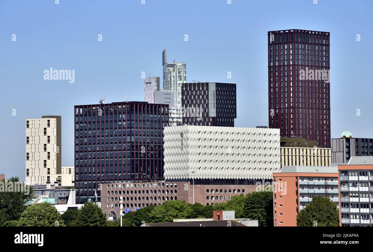 Manchester, UK. 1st August, 2022. Bright Summer sunshine in the morning in Manchester, England, United Kingdom, British Isles. A high level view of skyscrapers or high rise buildings or tower blocks in central Manchester, UK. Credit: Terry Waller/Alamy Live News Stock Photo