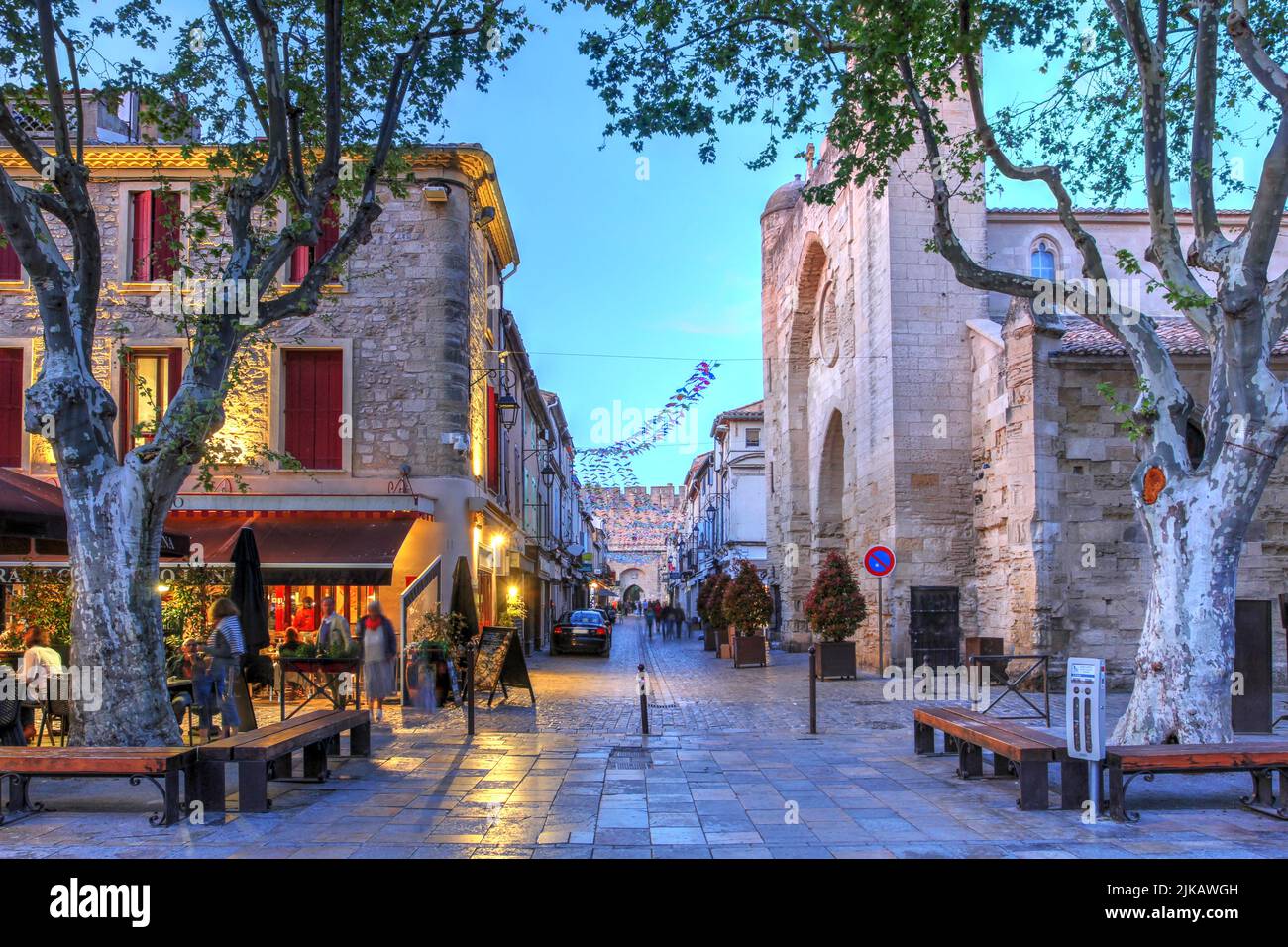 Place St-Louis at twilight within the walls of Aigues-Mortes, a medieval fortified town in the Camargue, Occitanie, south of France. Stock Photo