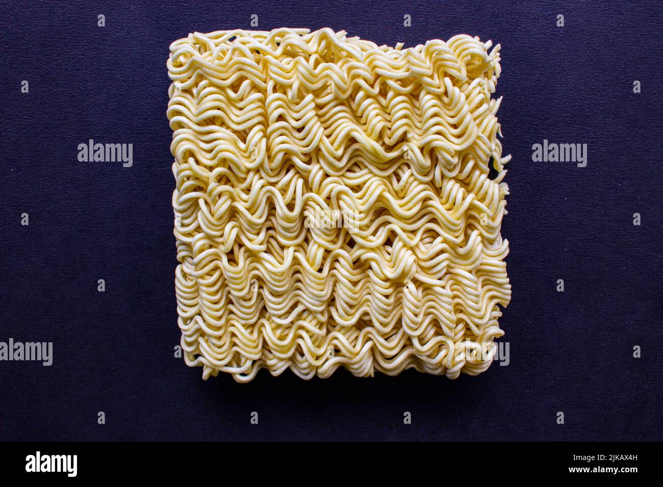 instant raw noodles isolated on black background Stock Photo Alamy
