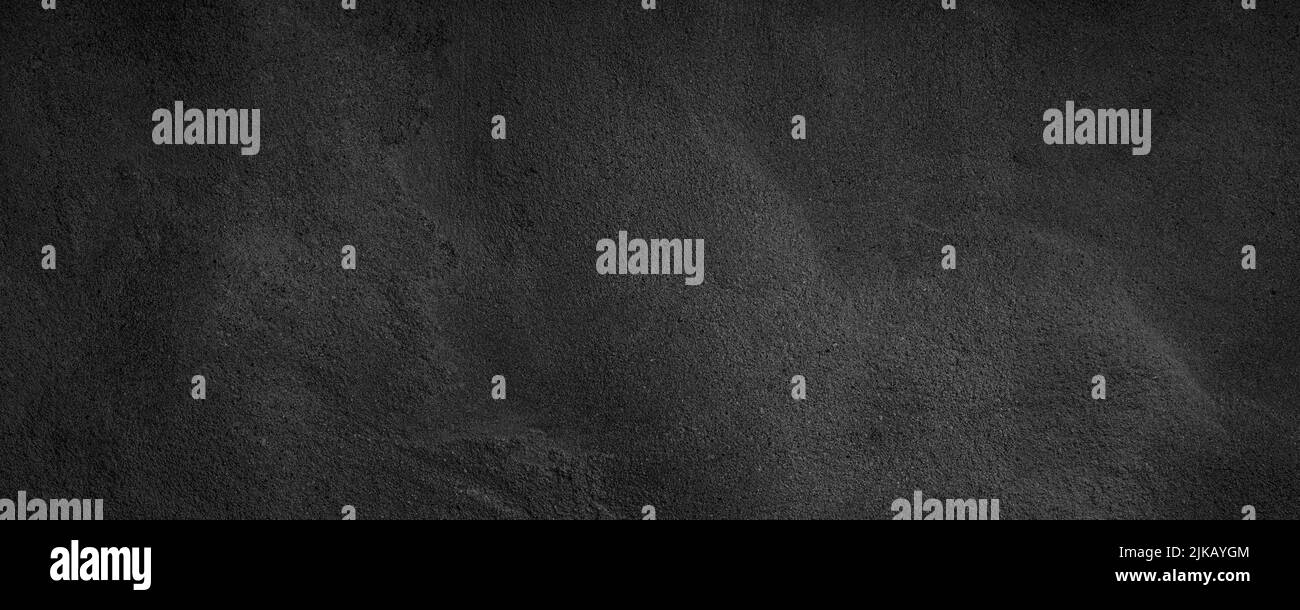 Black or dark gray rough grainy stone texture background Stock Photo