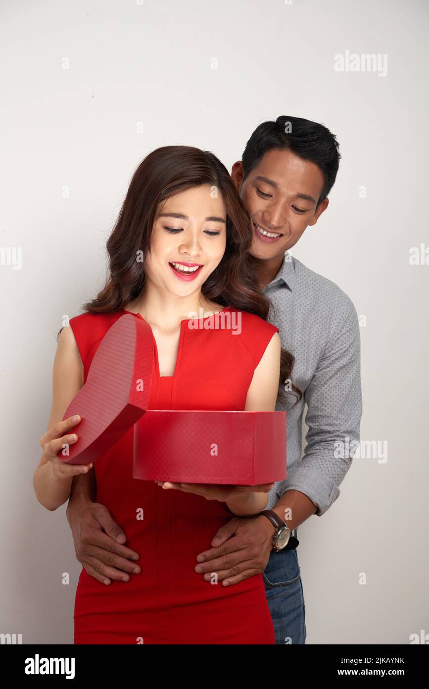 Young woman embracing gift hi-res stock photography and images - Alamy