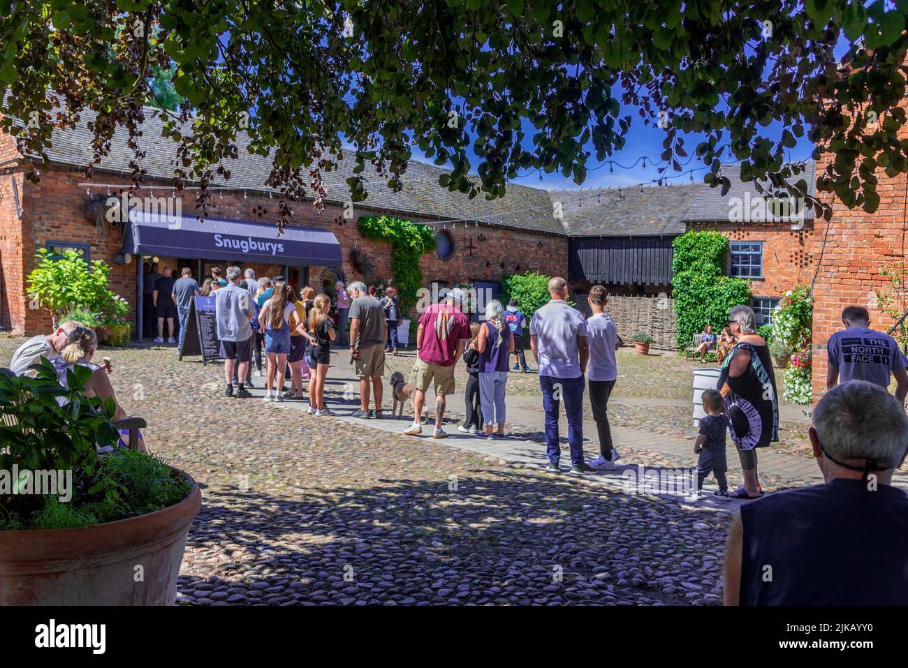 The queue on a summers day at Snugburys Ice Cream parlour on their farm in Nantwich in Cheshire. Stock Photo