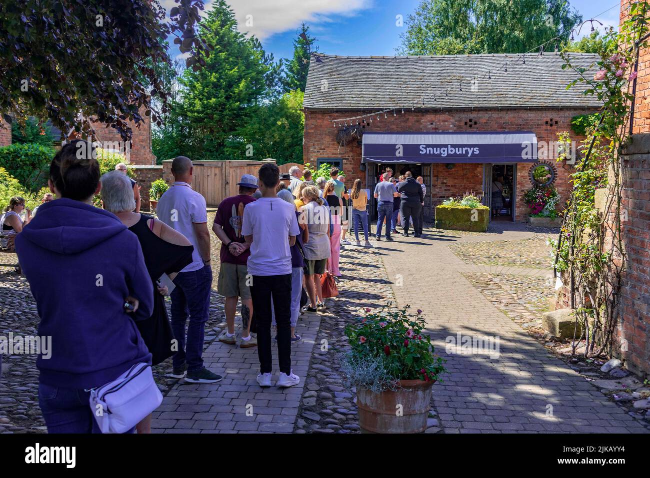 The queue on a summers day at Snugburys Ice Cream parlour on their farm in Nantwich in Cheshire. Stock Photo