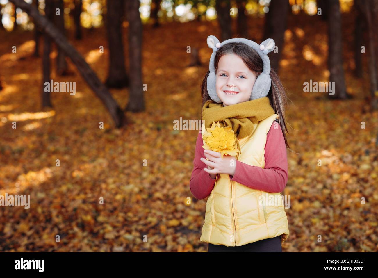 autumn season girl yellow maple leaves foliage Stock Photo - Alamy