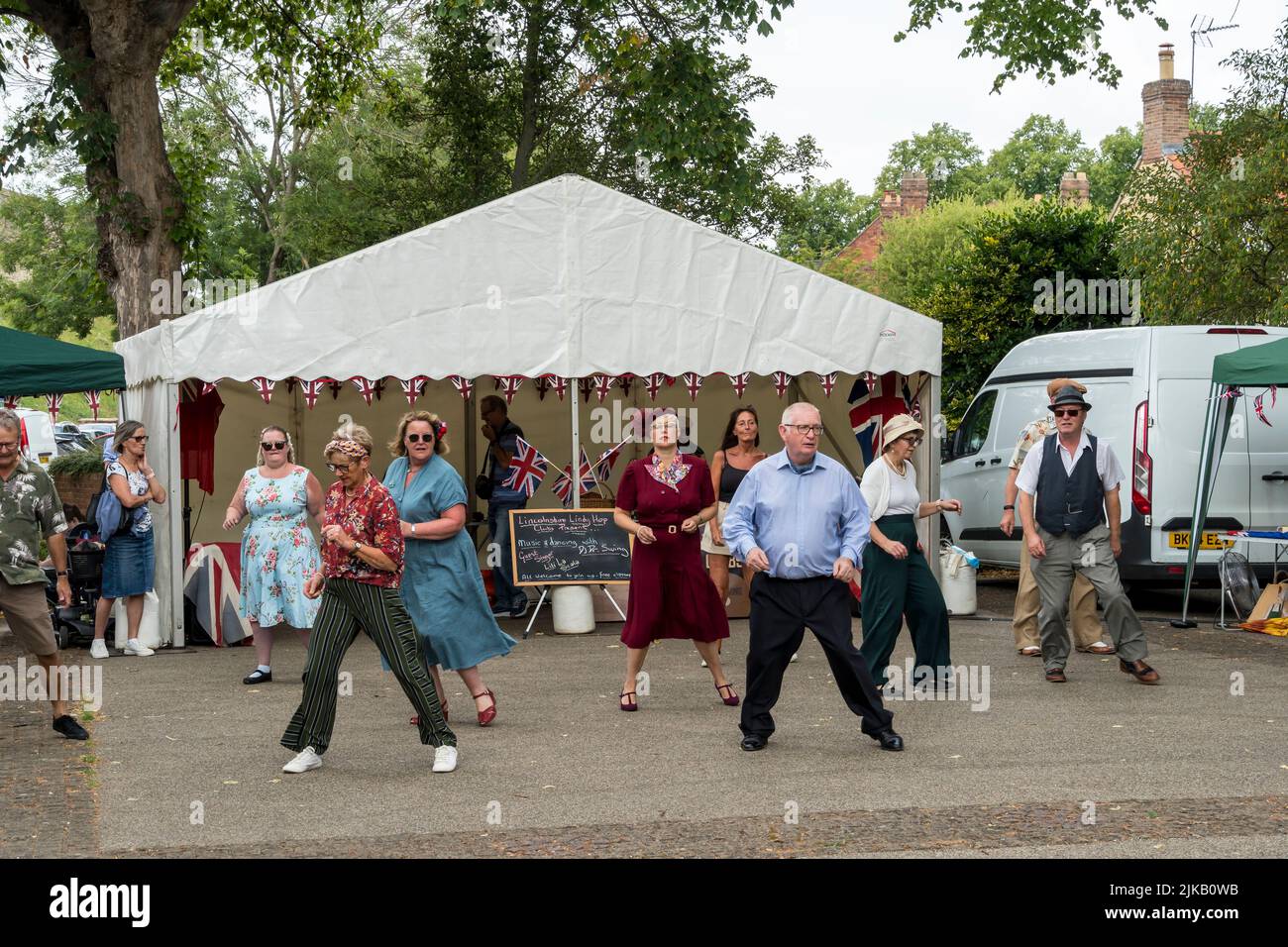 People line dancing during Lincoln 1940's weekend, Lincoln Cathedral Quarter, 23rd July 2022 Stock Photo