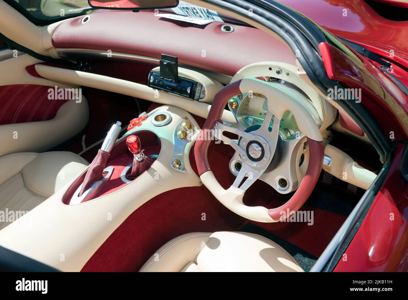 Interior view of the Cockpit of a Red,  2002, TVR Tuscan S on display at the Sandwich Classic Car Show Stock Photo