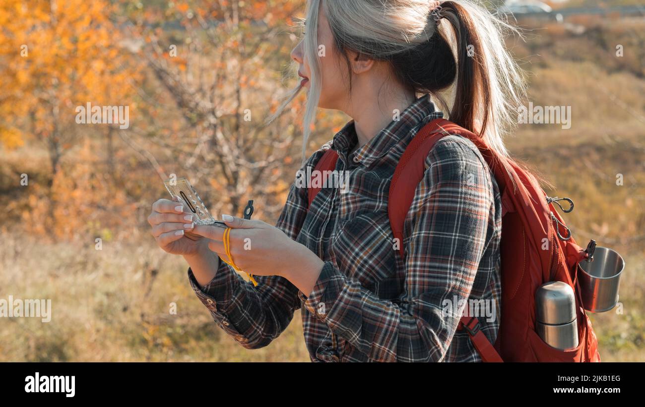 Hiking tourism lady compass hi-res stock photography and images - Alamy