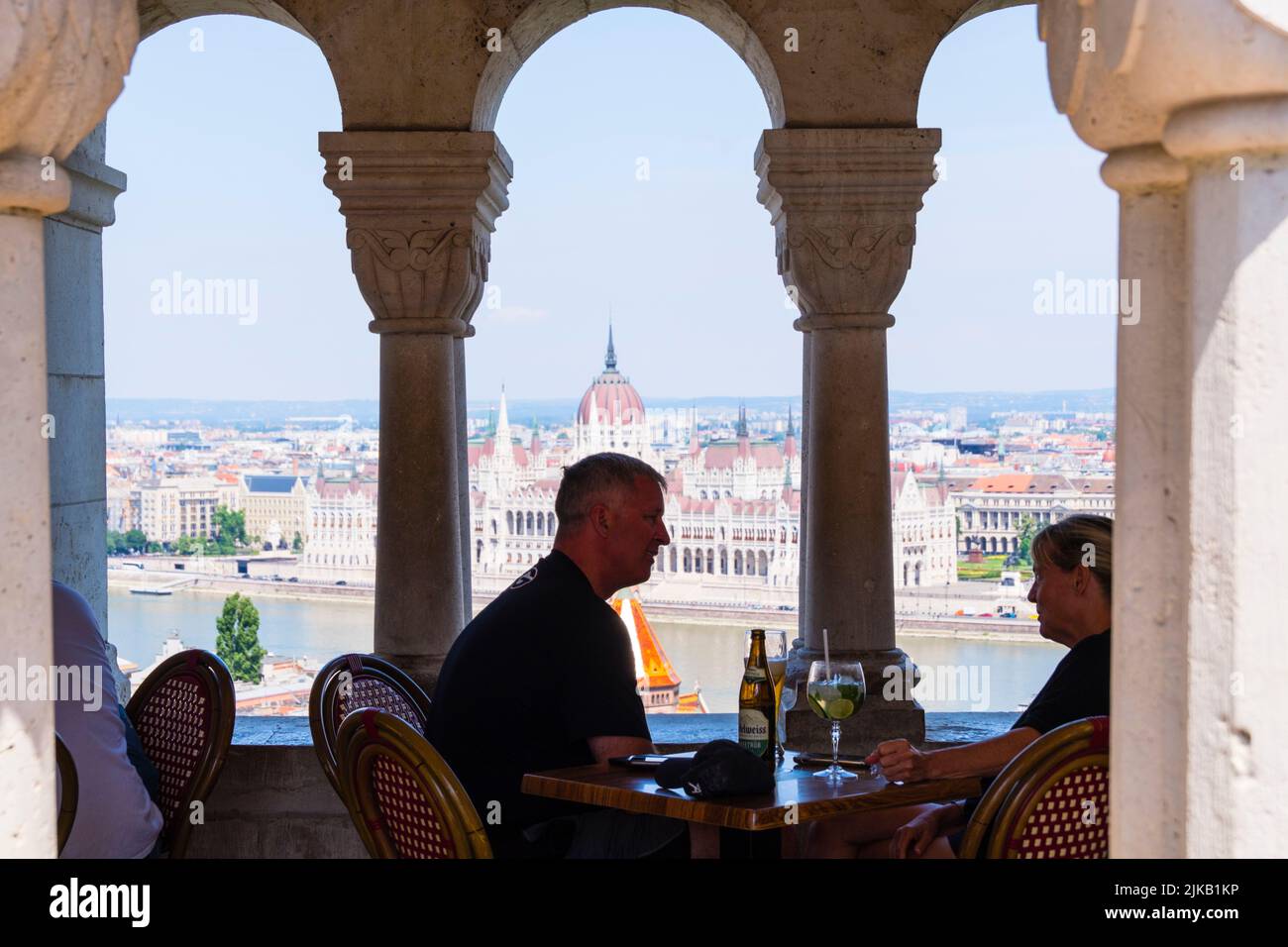 People at the panorama cafe of Fisherman's Bastion, with views towards Danube river and its embankments, Budapest, Hungary Stock Photo