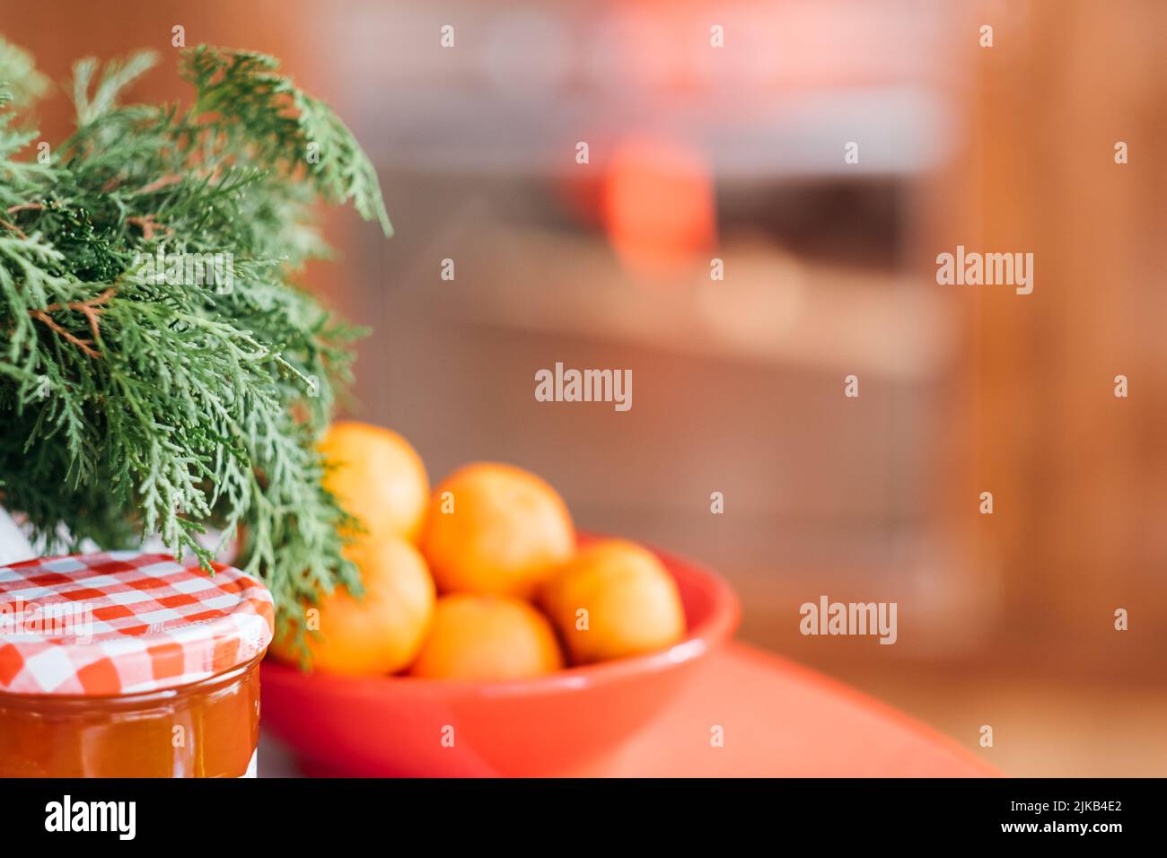 rustic winter holiday background juniper mandarins Stock Photo