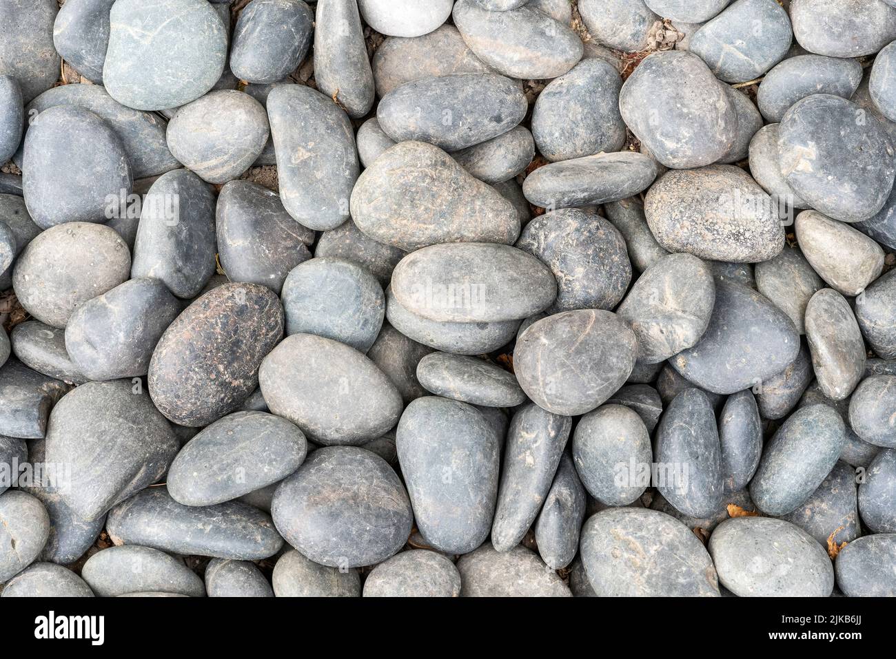 Abstract sea or river pebbles background with a smooth texture, stock phot image Stock Photo