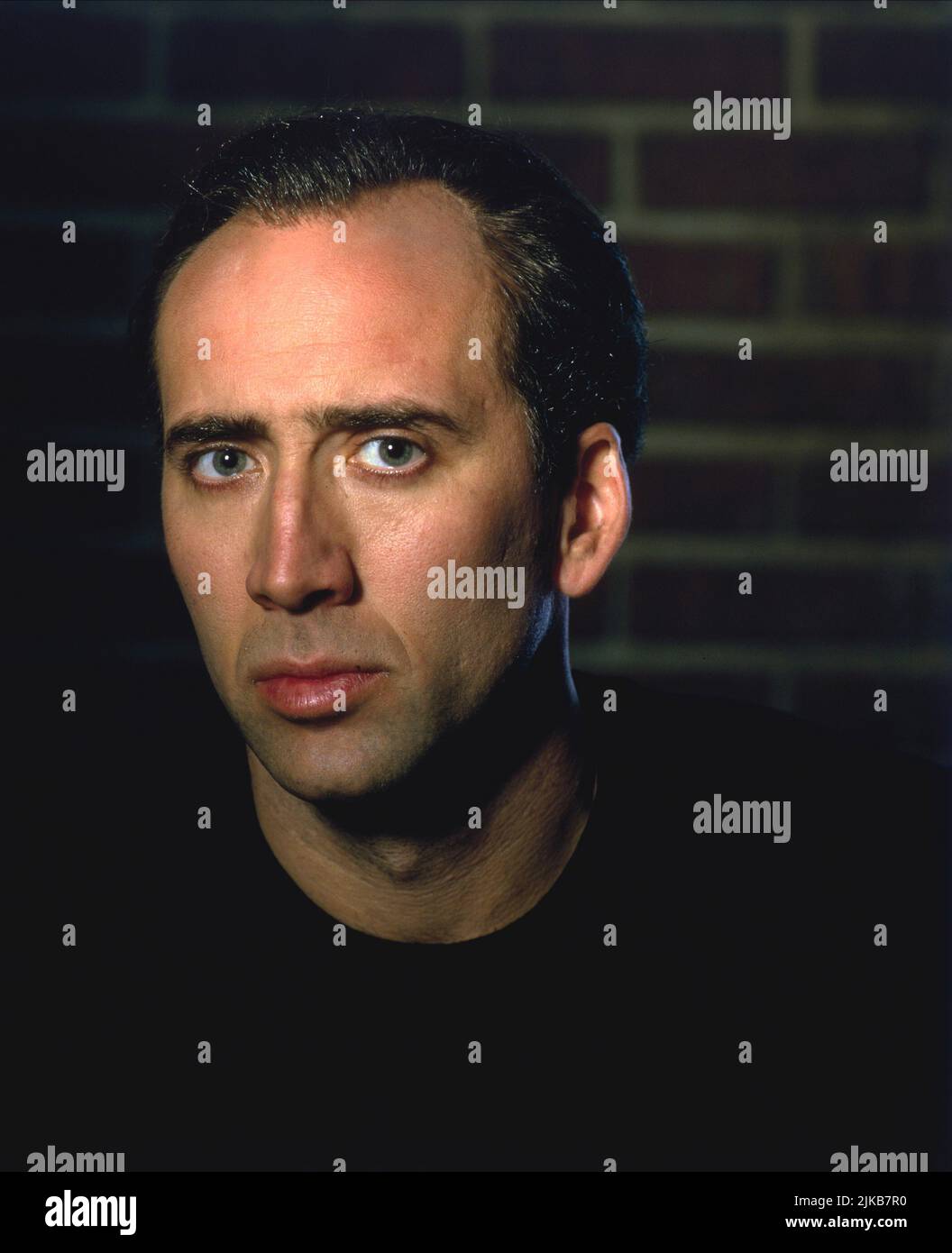 Nicolas Cage Film: 8mm (USA/DE 1999) Characters: Tom Welles  Director: Joel Schumacher 19 February 1999   **WARNING** This Photograph is for editorial use only and is the copyright of COLUMBIA PICTURES and/or the Photographer assigned by the Film or Production Company and can only be reproduced by publications in conjunction with the promotion of the above Film. A Mandatory Credit To COLUMBIA PICTURES is required. The Photographer should also be credited when known. No commercial use can be granted without written authority from the Film Company. Stock Photo