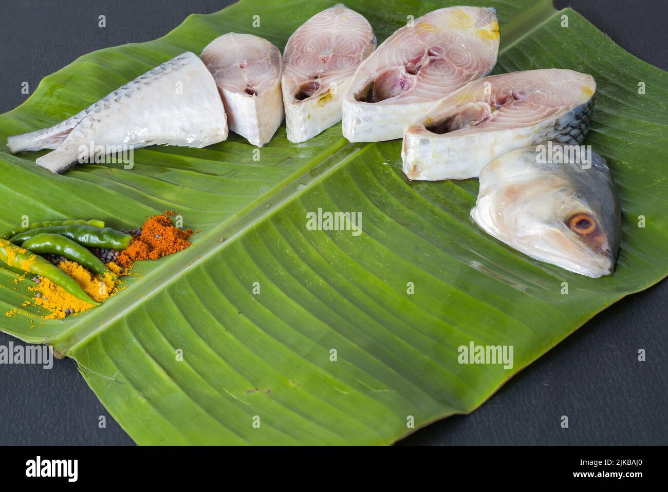 Hilsa Fish Roe Raw hilsa fish cut into pieces kept on banana leaf for cooking. Shot ...