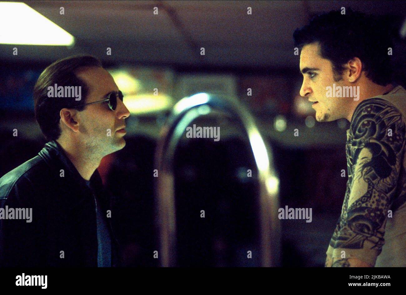 Nicolas Cage & Joaquin Phoenix Film: 8mm (USA/DE 1999) Characters: Tom Welles & Max California  Director: Joel Schumacher 19 February 1999   **WARNING** This Photograph is for editorial use only and is the copyright of COLUMBIA PICTURES and/or the Photographer assigned by the Film or Production Company and can only be reproduced by publications in conjunction with the promotion of the above Film. A Mandatory Credit To COLUMBIA PICTURES is required. The Photographer should also be credited when known. No commercial use can be granted without written authority from the Film Company. Stock Photo